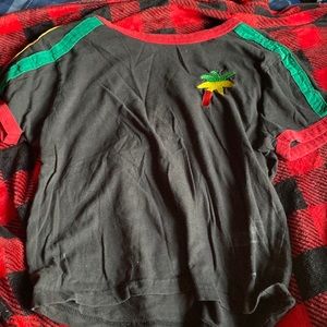 On fire brand shirt green yellow and red stripes on sleeves size medium